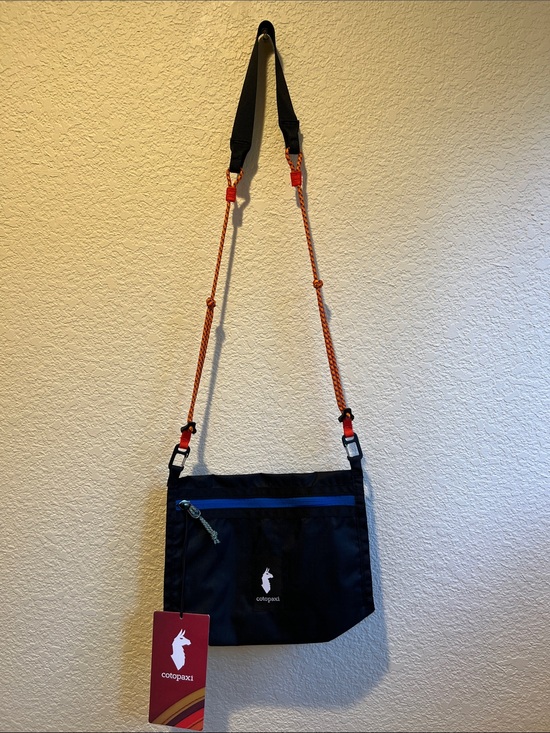cotopaxi Handbags - cotopaxi Black Crossbody Bag with Blue Zip and Orange Strap Accents
